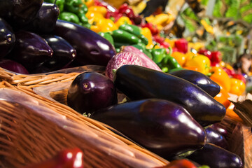 Aubergine and pepper on a shelf in a store