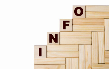 On a light background, wooden blocks and cubes with the text INFO