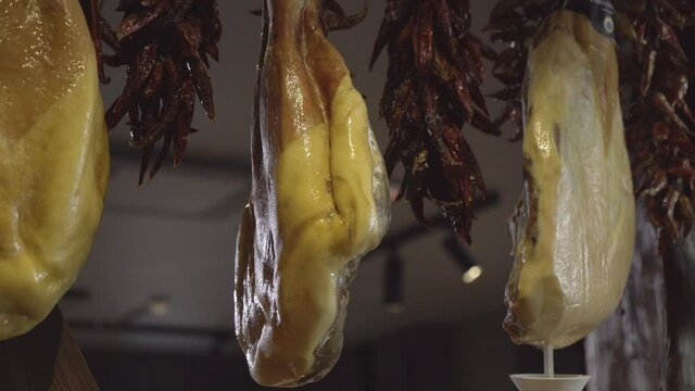 juicy hamons are hanging on ropes