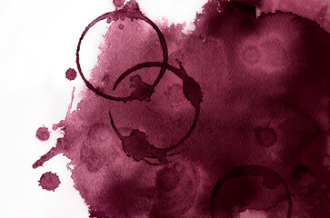 Red wine color background with spots of circles of wine glasses.