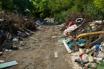 Big rubbish dump neare the road, nature and blue sky background
