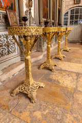 A place  for lighting candles in the interior of the St. Jacobs orthodox  cathedral Jerusalem in Christian quarters in the old city of Jerusalem, Israel