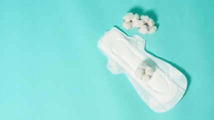 Sanitary napkin with wings for night usd and cotton flowers on mint green color or Tiffany Blue...