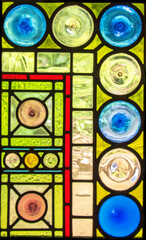 Stained glass panel incorporating squares and circles.