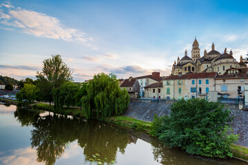 Fototapeta na wymiar Sunset view of the Isle river and the roman byzantine Saint Front cathedral from the bridge des Barris. Perigueux, Dordogne Department, Nouvelle Aquitaine region. France.