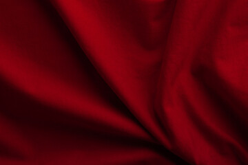 Texture of knitted red fabric. Red cotton background. Red fiber surface. Canvas backdrop.