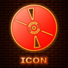 Glowing neon CD or DVD disk icon isolated on brick wall background. Compact disc sign. Vector