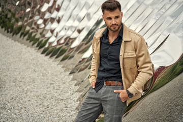 Handsome man wearing bomber jacket