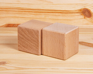 Bright wooden cube square on wood vintage background copyspace