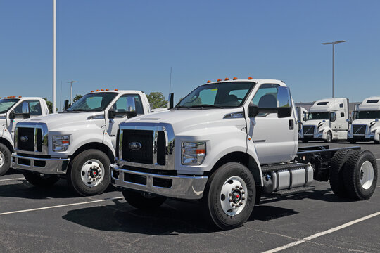 Ford F750 Dually Trucks at a dealership. Ford sells products under the Lincoln and Motorcraft brands.