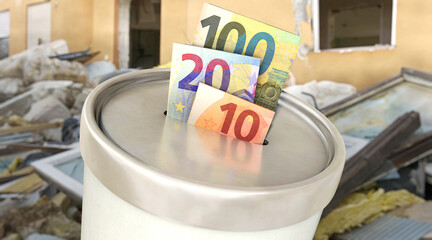 Spendendose mit Euroscheinen vor Hausruine