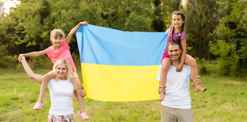 family with the flag of ukraine
