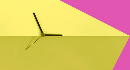 Daylight saving time concept. Clock hands on the cosy yellow pink  color block background. Seasonal...