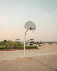 Basketball court on the beach at sunset, at Fire Island, New York © jonbilous