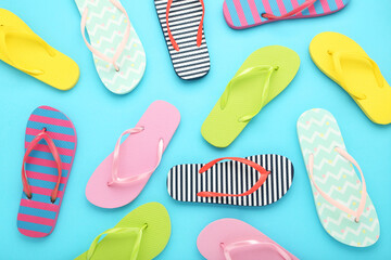 Colorful flip-flops on blue background