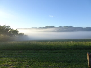 Cades Cove Great Smoky Mountains at sunrise with morning mist