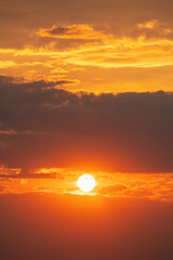 Beautiful sunset behind dark clouds