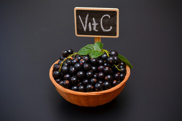 a portion of black currant and the inscription vitamin C