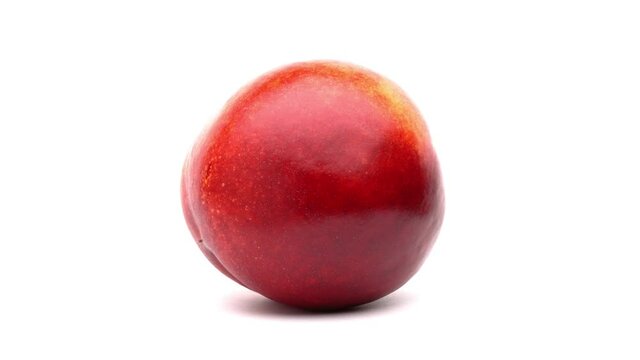 One nectarine rotating on white background.
