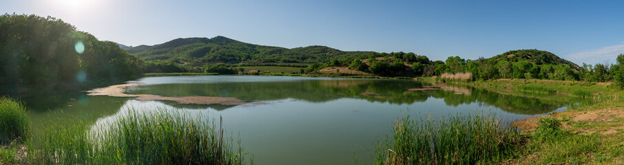 Small lake in the forest, panorama