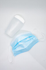 Face mask and plastic hand sanitizer