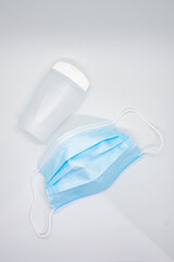 Face mask and plastic hand sanitizer