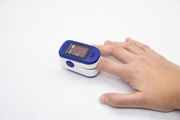 Hand using oximeter on index finger