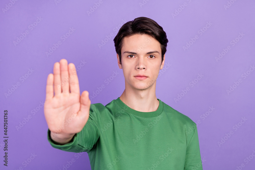 Poster photo of young handsome guy negative show hand no stop sign decline ban rule isolated over violet co