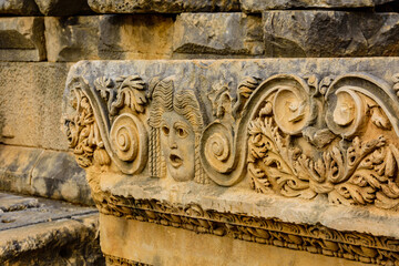 Stone faces bas relief at the Myra ancient city. Demre, Turkey