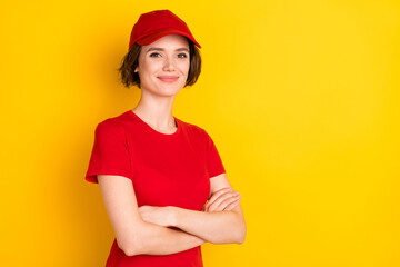 Photo of nice optimistic brown hair lady crossed arms wear t-shirt cap isolated on yellow background