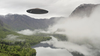Flying Saucer ufo over lake and mountains fly away
Aerial view over Europe landscape lake mountains...
