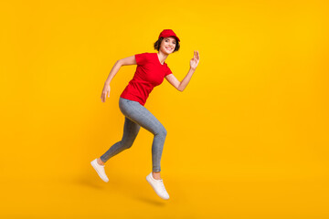 Plakat Full size profile photo of nice optimistic brown hair lady jump wear t-shirt cap isolated on yellow background