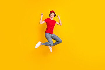 Full size profile photo of nice optimistic brown hair lady jump wear t-shirt cap isolated on yellow background