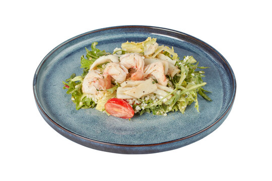Warm salad with shrimp and squid, restaurant dish, image isolate