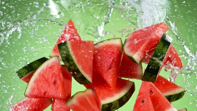 Super slow motion of sliced water melon with water splash flying in the air. Filmed on high speed cinema camera, 1000 fps.