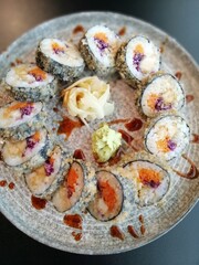 fried rolls in a circle on a round plate. top view. delicious Japanese food.