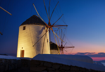 Mykonos, Greece. Traditional windmills. The symbol of Mykonos during  sunset. Landscape during...