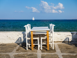 A restaurant overlooking Little Venice, Mykonos Island, Greece. Lunch and dinner overlooking the sea. Photo as wallpaper.