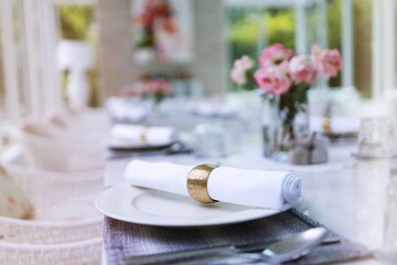 The wedding decor. Tables set for an event party or wedding reception. luxury elegant table setting dinner in a restaurant. glasses and dishes. hall for banquets and weddings.