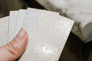 Show to the buyer samples of edging for kitchen countertops.