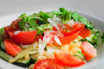 Chopped tomatoes, cucumbers, onions and green salad.