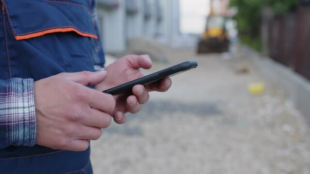 Close up view of a man who holds his phone