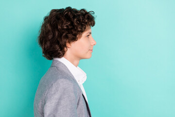 Photo of confident attractive schoolboy dressed grey suit smiling looking empty space crossed...