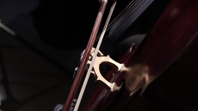 a string quartet plays a classical symphony in a dark hall