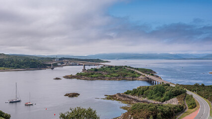 The Skye Bridge is a road bridge over Loch Alsh, Scotland, connecting the Isle of Skye to the island of Eilean Bàn and onto the mainland. Kyleakin Lighthouse can also be seen on the island