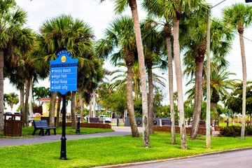 Venice, Florida retirement city town in gulf of Mexico with palm trees on street with information...