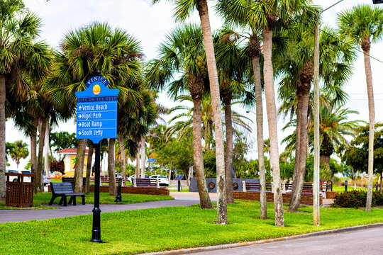 Venice, Florida Retirement City Town In Gulf Of Mexico With Palm Trees On Street With Information Direction Sign To Beach, Higel Park And South Jetty Boat Ramp