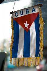 cuban flag hanging in car. for a free cuba. cuba libre. island of freedom. cuban revolution