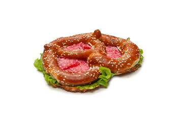 Pretzel with salami and lettuce isolated on a white background.