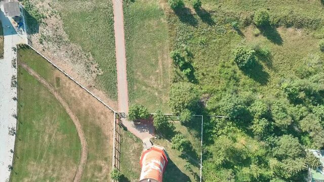 Flight from Pakri lighthouse towards the rocky cliff and calm sea